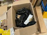 a cardboard box full of assorted items on the floor