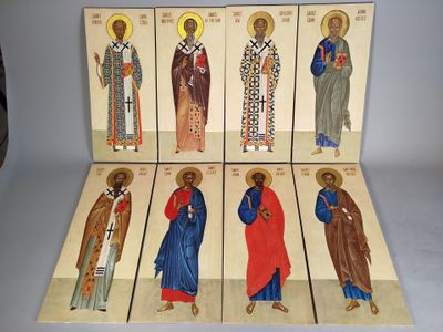 six wooden icons of saints in different colors and sizes