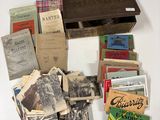 many old books on a table with a wooden box