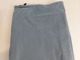 a close up of a blue skirt on a white surface