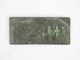 a metal plaque with a picture of a man and a woman on it