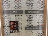 many glasses on display in a display case