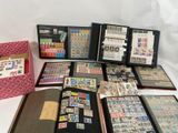 a lot of stamps and stamps in a folder