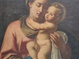 an old painting of a woman holding a baby in her arms