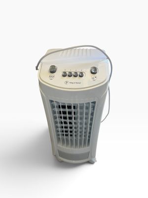 a small air conditioner sitting on a white surface