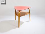 an image of a pink table with a wooden base