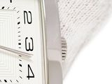a close up of a wrist watch with a white face