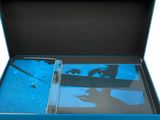 a blue box with a picture of a person holding a cell phone