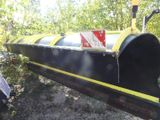 an image of a black and yellow machine with a yellow stripe