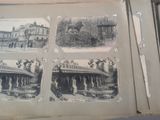 an old photo of a book with pictures of buildings and people on it