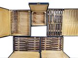 many knives and knives in a case on the table