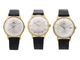 three different types of watches on a white background