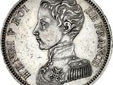 a silver coin with an image of a man in a uniform