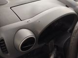 a close up of a car dashboard with a steering wheel