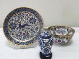 two bowls and a plate sitting on a table