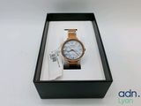 an image of a watch in a box on a white surface