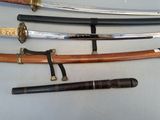 four different types of swords on display on a table