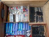 a box full of tools that are sitting on the floor