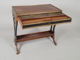 a small wooden desk with a drawer on top of it