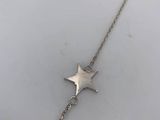 a silver bracelet with a star charm on it