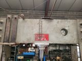a picture of a machine that is working on a piece of metal