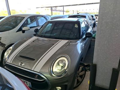 many cars parked in a parking lot next to each other