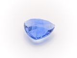 a blue sapphire stone on a white background