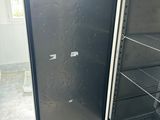 a refrigerator that is open and sitting in a room