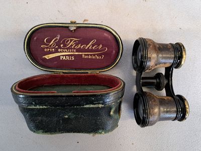 two binoculars sitting next to each other on a table