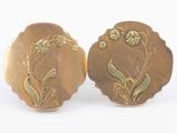 pair of antique gold plated earrings with flowers and leaves on them