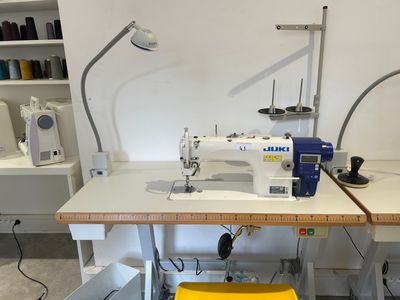 a sewing machine sitting on a table in a room