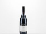 a bottle of wine that is sitting on a table