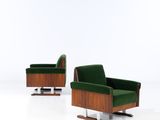 pair of mid - century danish lounge chairs with green velvet upholstered seats