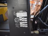 a close up of a forklift with a label on it