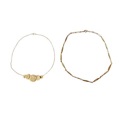 two bracelets with gold beads on a white background
