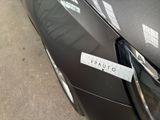 a close up of a car with a sticker on the front of it