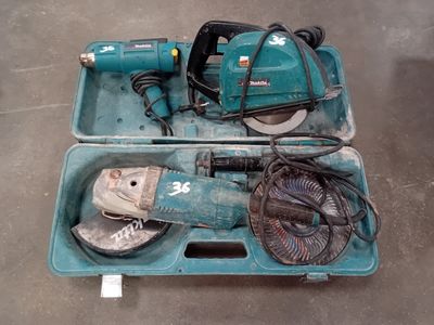 a blue box with tools in it sitting on the floor