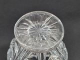 a clear glass vase with a flower inside of it