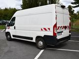a white van that is parked in a parking lot