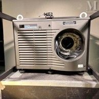 an old fashioned washing machine sitting on top of a counter