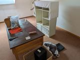 an image of a room with a desk and a window