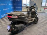 an image of a motor scooter parked in a showroom