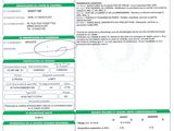 a green and white document with a barcode on it