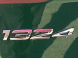 a close up of a car ' s emblem on the side of the car