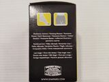 a close up of a black box with a yellow and white label on it