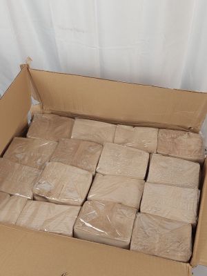 a cardboard box full of soap bars on a table