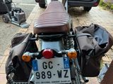a motorcycle that is parked on the side of the street