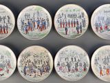 nine plates with different designs on them on the wall