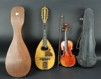 four different types of musical instruments are lined up against a black background