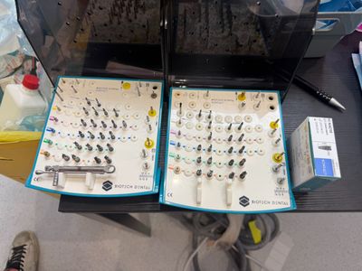 a table with a bunch of electronics on top of it